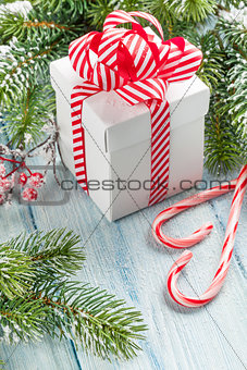 Christmas gift box, candy cane and fir tree