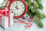 Christmas gift box, alarm clock, candy cane and fir tree
