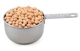 Dried chick peas in a measuring cup