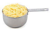 Shredded cheese in a measuring cup
