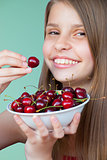 Beautiful teenage girl with cherries
