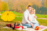picnic autumn day. happy couple relaxing