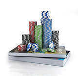 Stacks of poker chips on a book. Poker education.
