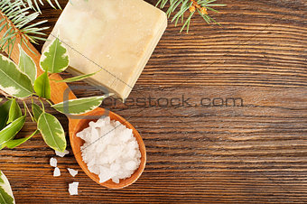 Salt in a wooden spoon and soap