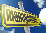 Yellow road sign with management word under blue sky