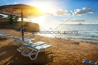 Chaise-longues on a beach