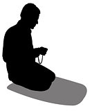 performing five time prayer, silhouette of a Muslim Praying