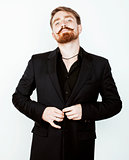 young red hair man with beard and mustache in black suit on white background
