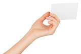 Womans left hand offering small empty card
