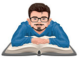 Man reading book. Young man in glasses placed his hands on an open book