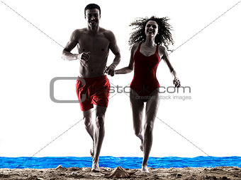 couple walking running on the beach