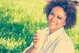 African American Woman Drinking Coffee Outside