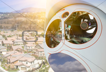 Closeup of Drone Camera and Sensor Pod Module Above Neighborhood
