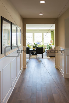 Home Entry Way with Wood Floors and Wainscoting