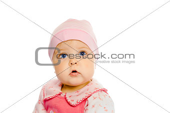 baby girl in a pink dress and hat. Portrait. Studio. Isolated.