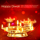 Golden diya stand on abstract Diwali background