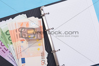 money and blank notepad