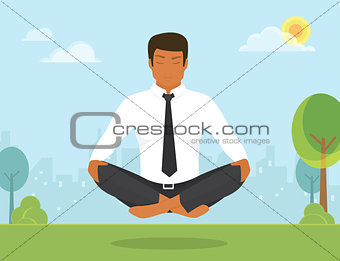 Man is doing yoga and sitting in the lotus position
