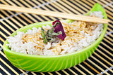 Rice in clay bowl with wooden chopsticks