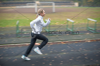 Woman running in the stadium