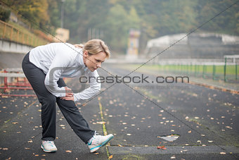 Woman exercising in the stadium