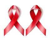 AIDS awareness red ribbon on white background.