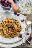 Rice with carrots, raisins and cranberries.