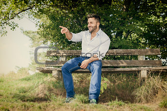 man outdoors pointing
