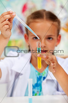 Young chemist - little girl in science class