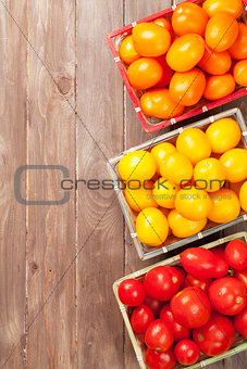 Colorful tomatoes on wooden table