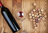 Red wine bottle glass and grape shaped corks