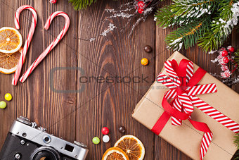 Christmas background with gift, camera and tree branch