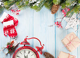 Christmas background with tree, alarm clock and gifts