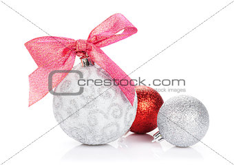 Christmas baubles and red ribbon