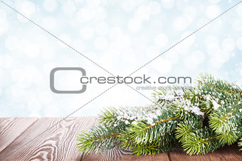 Christmas tree branch on wooden table