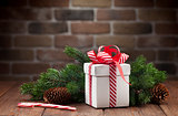 Christmas gift box and fir tree branch