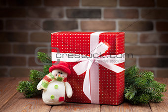Christmas gift box, snowman and tree branch