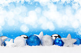 Christmas background with baubles and snow