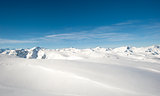 Panoramic view over a snowy mountain range
