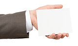 Businessman holding small empty sheet of paper