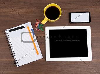 Blank copybook with tablet and coffee