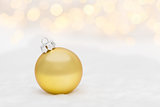 Golden Christmas ball on white