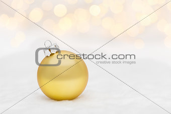 Golden Christmas ball on white