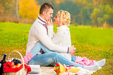 meeting loving couple in the park on a picnic