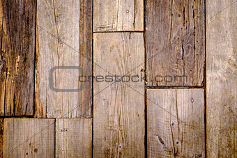 Close-up view of textured and weathered wooden tiles 