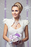 Beautiful winter bride in warm dress with flowers
