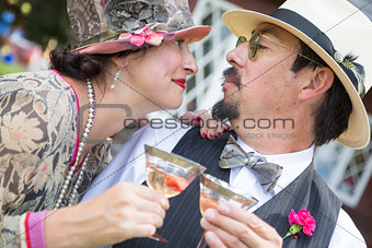 Mixed-Race Couple Dressed in 1920âs Era Fashion Sipping Champa