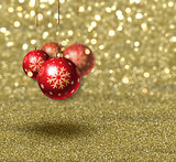 Christmas baubles on gold glitter background
