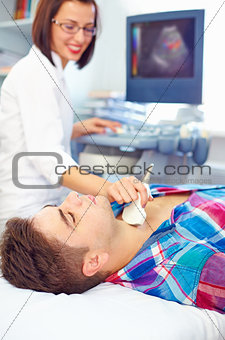 ultrasound scanning of a thyroid of man