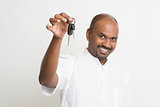 Mature Indian man holding car key